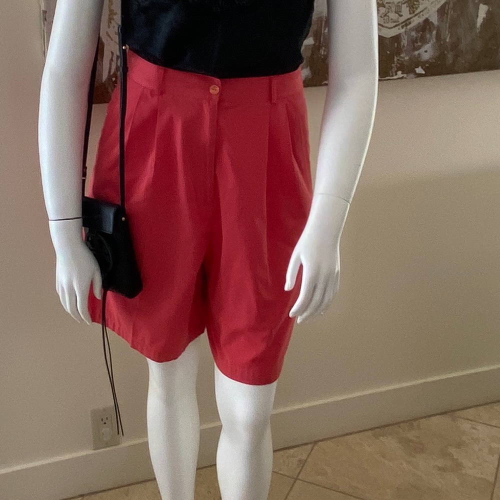 Salmon colored Bermuda length shorts